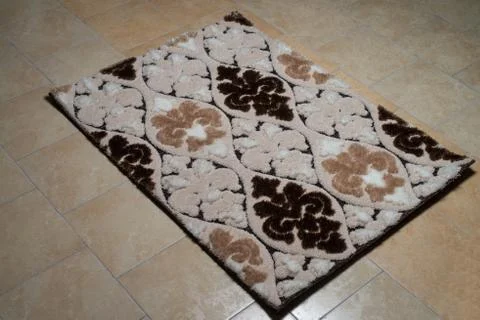 Pattern carpet lying on floor Stock-Fotos