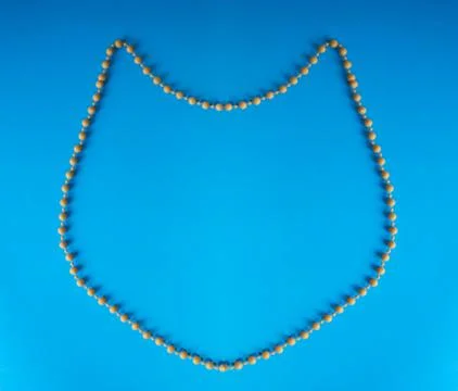 Pattern of a cat's head made of beads. Stock Photos