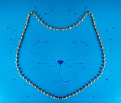 Pattern of a cat's head made of beads. Stock Photos