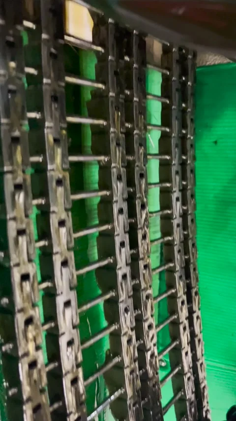 Pattern chain on a knitting machine Stock Footage 267432798