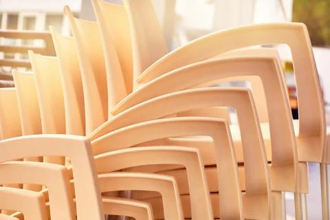 A pattern of chairs stacked on top of each other Stock Photos