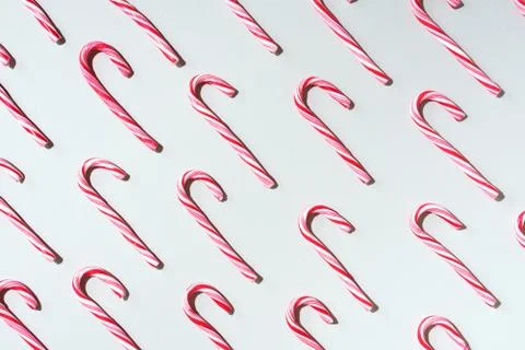 Pattern of Christmas candy cane on grey background. Top view. Flat lay. Creative 스톡 사진