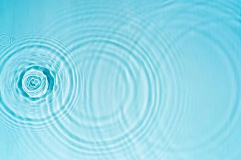 Pattern of circles on clear water from drops Stock Photos