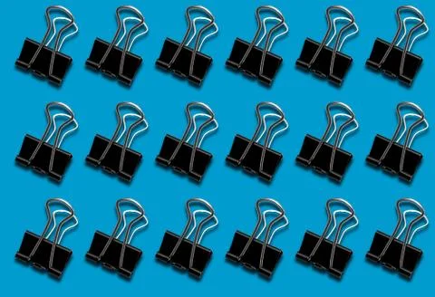Pattern with a clerical clip on a blue background. Foto stock