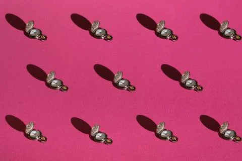 Pattern of clock on background of pink color. Top view Foto stock