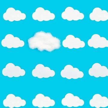 Pattern with clouds on a blue background. White clouds cut out of paper an... Stock Photos