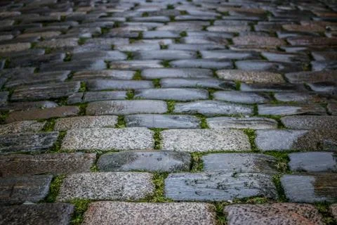 Pattern of a cobblestones on a road Stock Photos