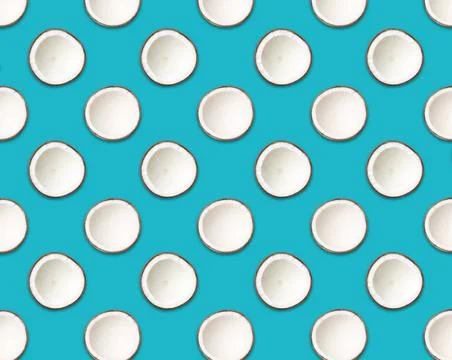 Pattern of coconut halves on pacific blue background Stock Photos