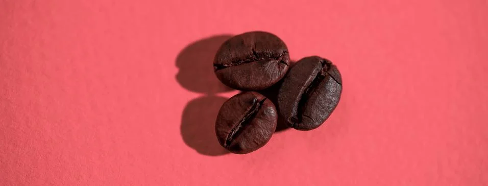 The pattern of coffee beans on colored background Stock Photos