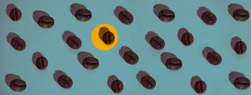 The pattern of coffee beans on colored background 写真素材