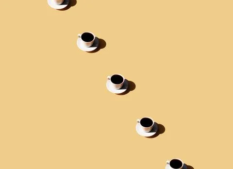 Pattern of coffee cup and plate, shadow of sun on beige terracotta background 스톡 사진