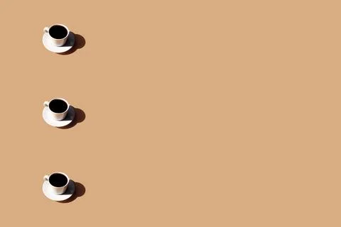 Pattern of coffee cup and plate, shadow of sun on beige terracotta background 스톡 사진