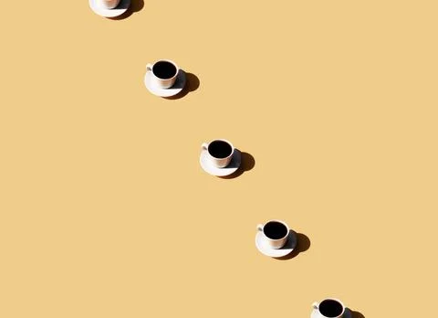  Pattern of coffee cup and plate, shadow of sun on beige terracotta backgr... Stock Photos