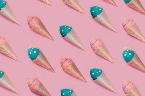 Pattern with colored decorated eggs in bamboo cones looks like ice cream on pink Stock Photos