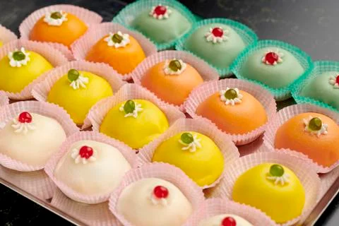 Pattern of colored mini Sicilian "Cassata" dessert Stock Photos