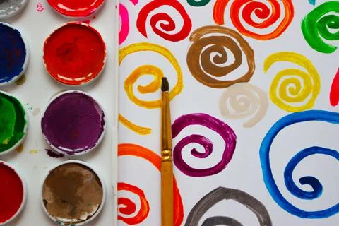 Pattern of colored painted spirals from watercolor paints and gouache 库存照片