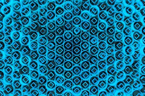 Pattern of colored tubes, repeated square elements, black hexagons and surfac Stockillustratie