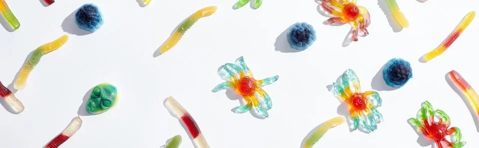 Pattern colorful gummy spiders worms Stock Photos