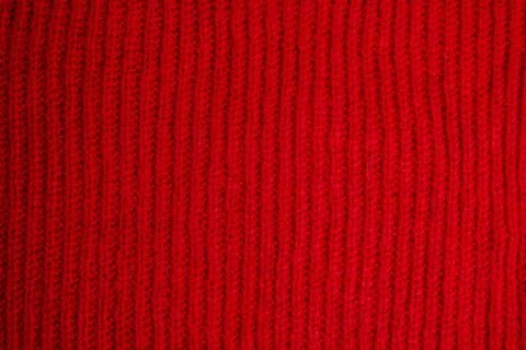 Pattern of colorful knitted sweaters closeup. Handmade merino wool product... Foto stock