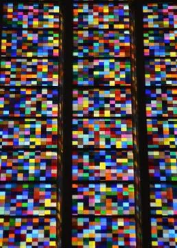 A pattern of coloured squares in a stained glass window. Stock Photos