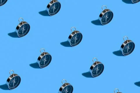 Pattern of compass. Trendy background of compass on a blue background. Colorf Stock Photos