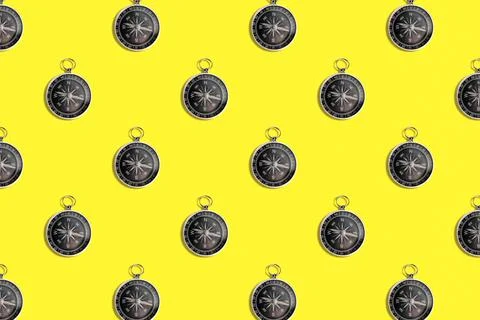 Pattern of compass. Trendy background of compass on a yellow background. Colo Stock Photos