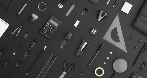 Pattern composition of office and school stationery on black leather backgrou Stock Photos