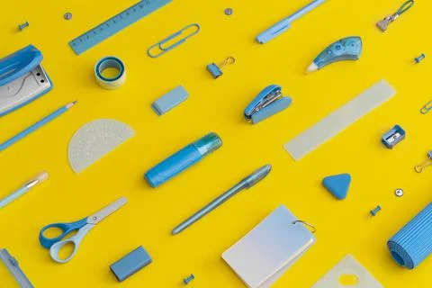 Pattern composition of school stationery on a yellow background. Top view. Fl Fotos de archivo