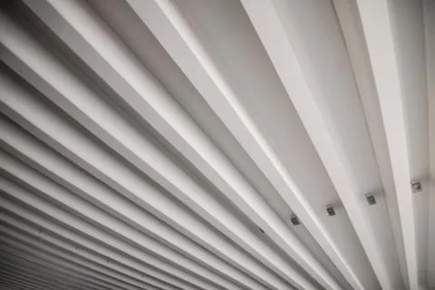 Pattern of concrete bars under the deck in a parking house. Stock Photos