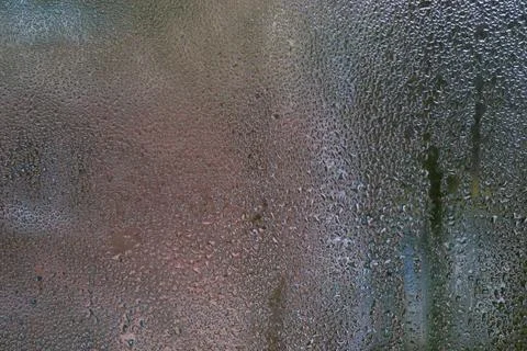 Pattern of condensation forms on a chilled glass surface, with water drople.. Stock Photos