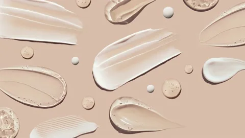 Pattern cosmetic smears of creamy texture on a pastel beige background Stock Footage 217378661