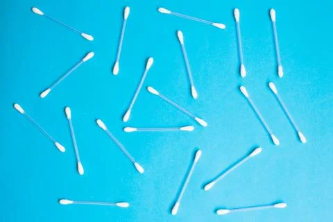 The pattern of the cotton buds on a blue background Stock Photos
