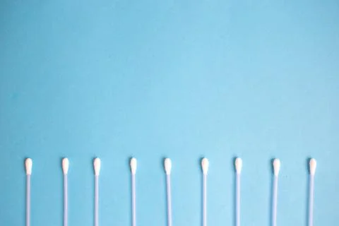 The pattern of the cotton buds on a blue background Stock Photos