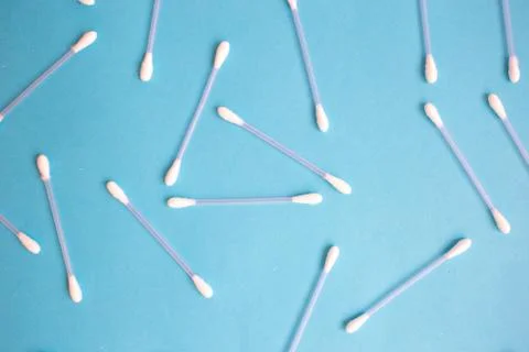 The pattern of the cotton buds on a blue background Stock Photos