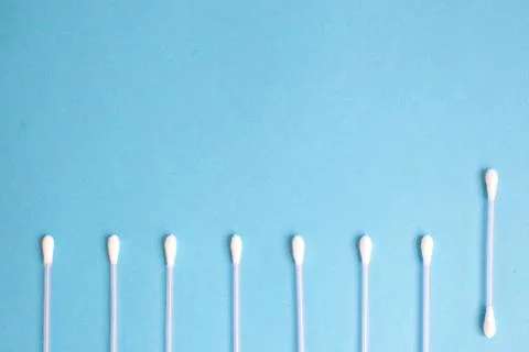 The pattern of the cotton buds on a blue background Stock Photos