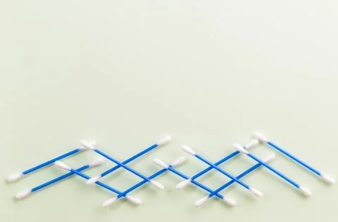 Pattern of cotton buds on a light background Stock Photos