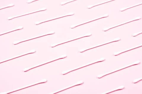 Pattern of cotton swabs on pink background. Stock Photos
