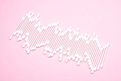 Pattern of cotton swabs on pink background. Stock Photos