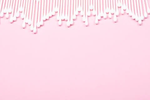 Pattern of cotton swabs on pink background. Stock Photos