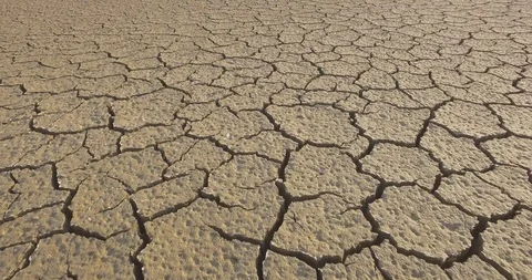 Pattern of cracks in the mud during a drought moving forward Stock Footage
