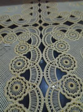 Pattern of a cream-colored floral lace tablecloth texture Stock Photos