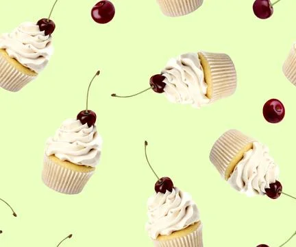 Pattern of cupcakes and cherries on light green background Stock Photos