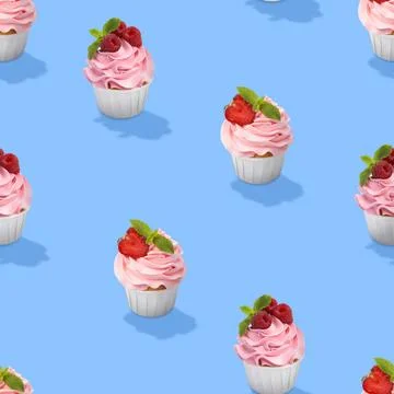 Pattern of cupcakes with berries on blue background Stock Photos
