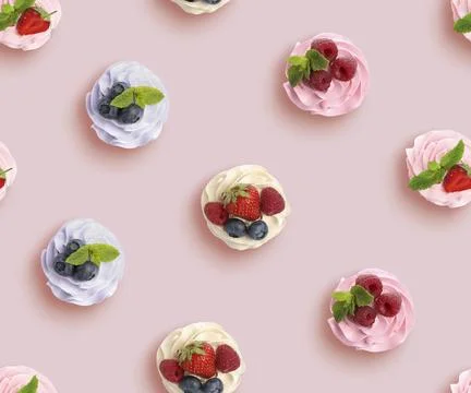 Pattern of cupcakes with berries on pink background, top view Stock Photos