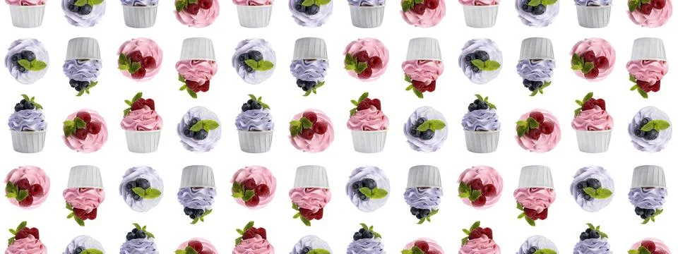 Pattern of cupcakes with berries on white background Stock Photos