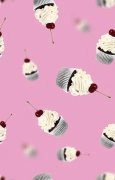 Pattern of cupcakes with cherries on pink background Stock Photos