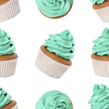 Pattern of cupcakes with turquoise cream on white background Stock Photos