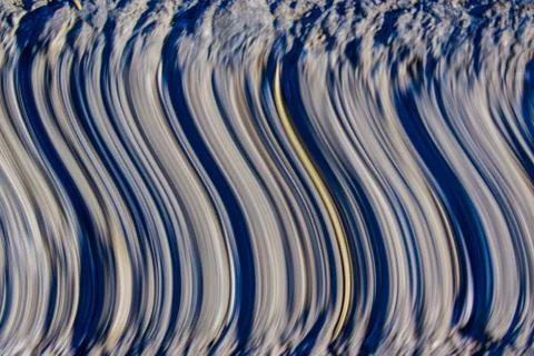 Pattern of curves and lines of grey and blue making a pattern Stock Photos