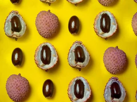 Pattern of cut lychees. Round pimply fruits. Chinese plum. Fruit peel. Peelin Fotos de archivo