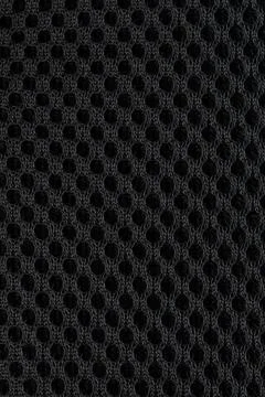 Pattern of dark cloth with circle holes Stock Photos